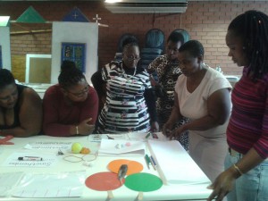 FCM Facilitators in from Lesedi and Tshepang in the Free State working through the Ladders to Learning exercise, which helps children to build foundations for writing.
